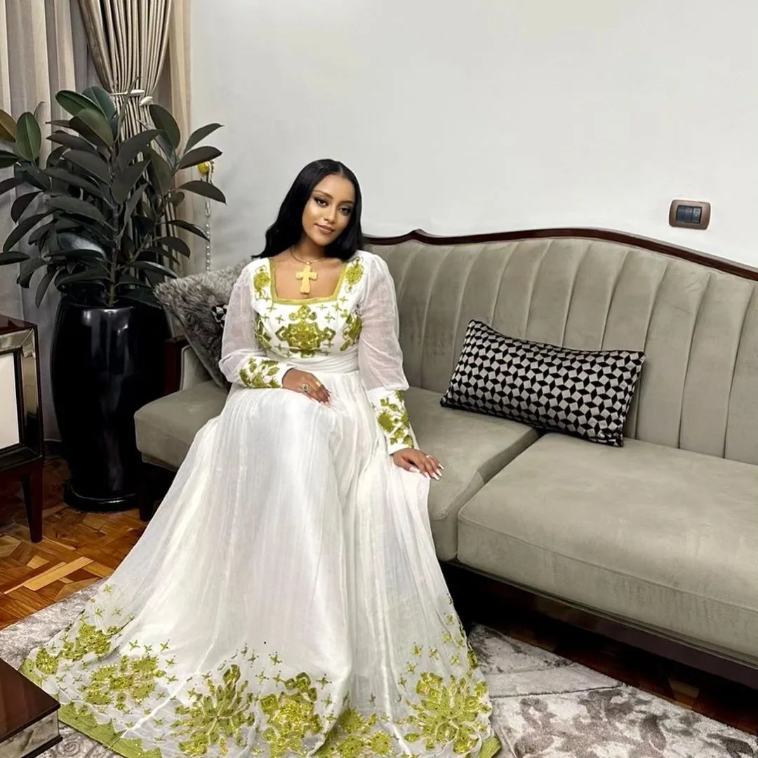 Sunny Elegance: Modern Menen Fabric in Yellow Habesha Kemis