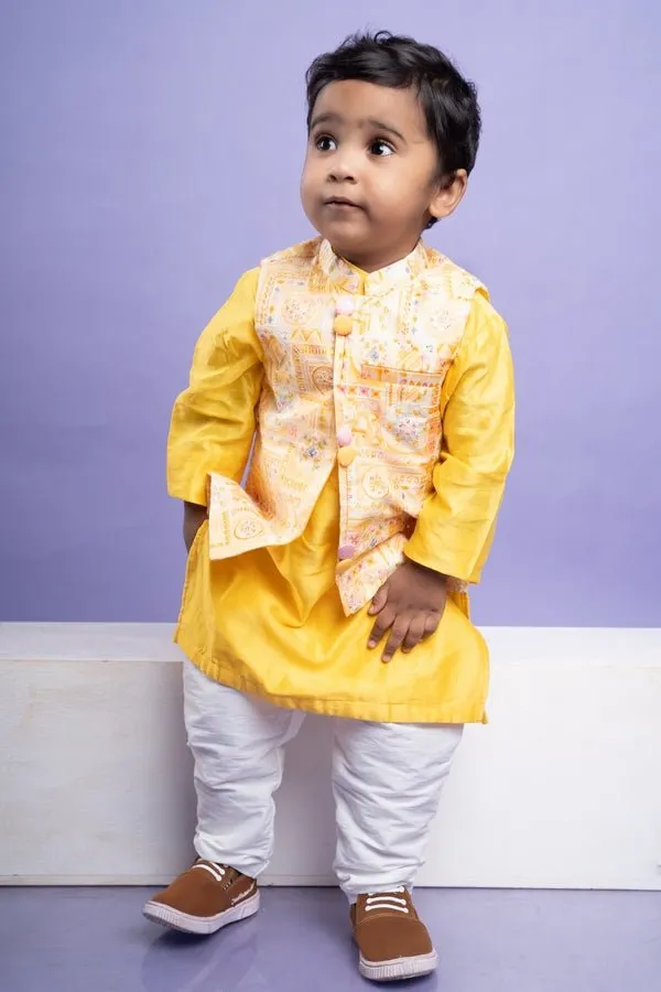 Vibrant yellow kurta set with an embroidered Peach Nehru jacket, paired with classic white churidar pants for a festive look