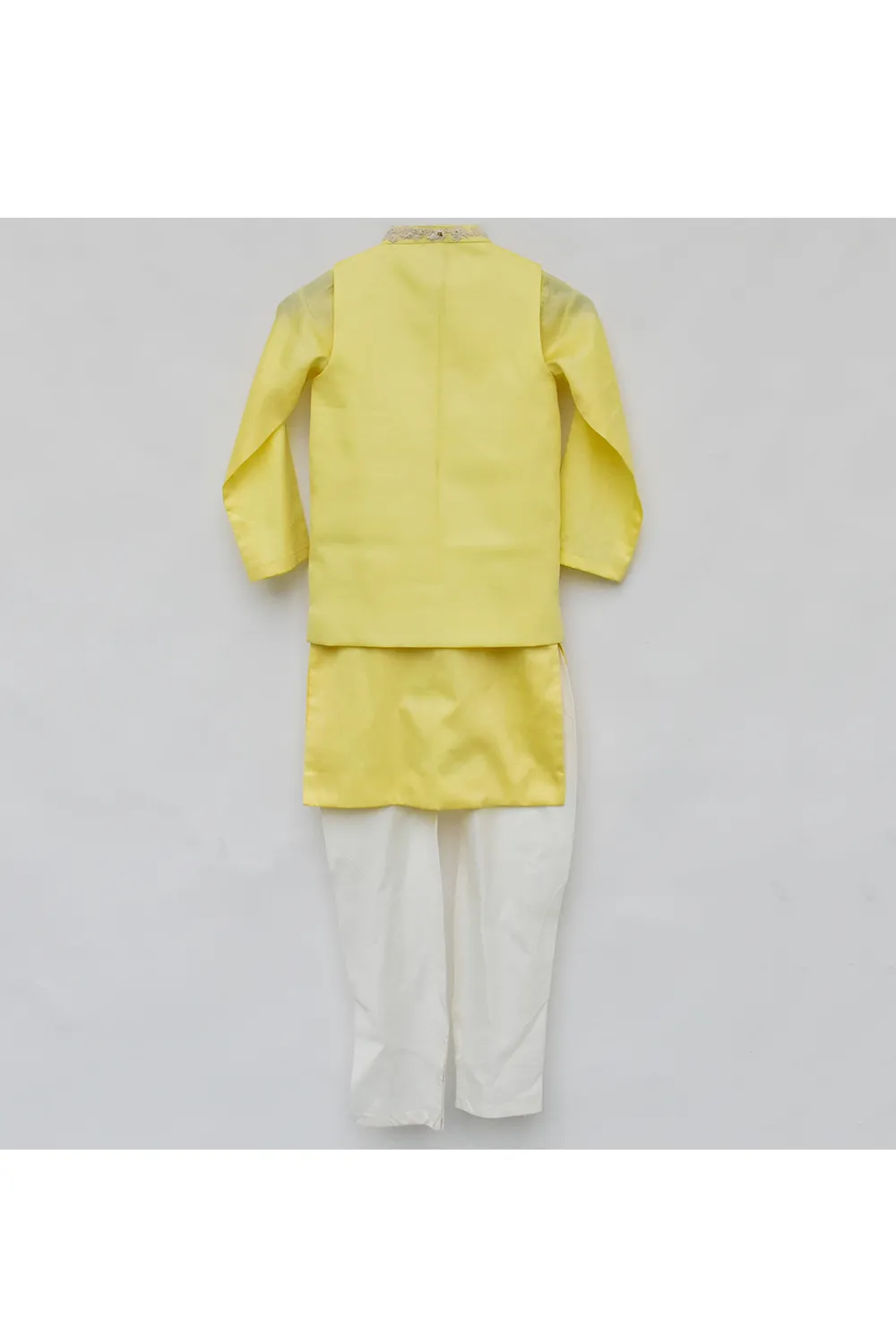 Yellow silk kurta with nehru jacket and white pyjama